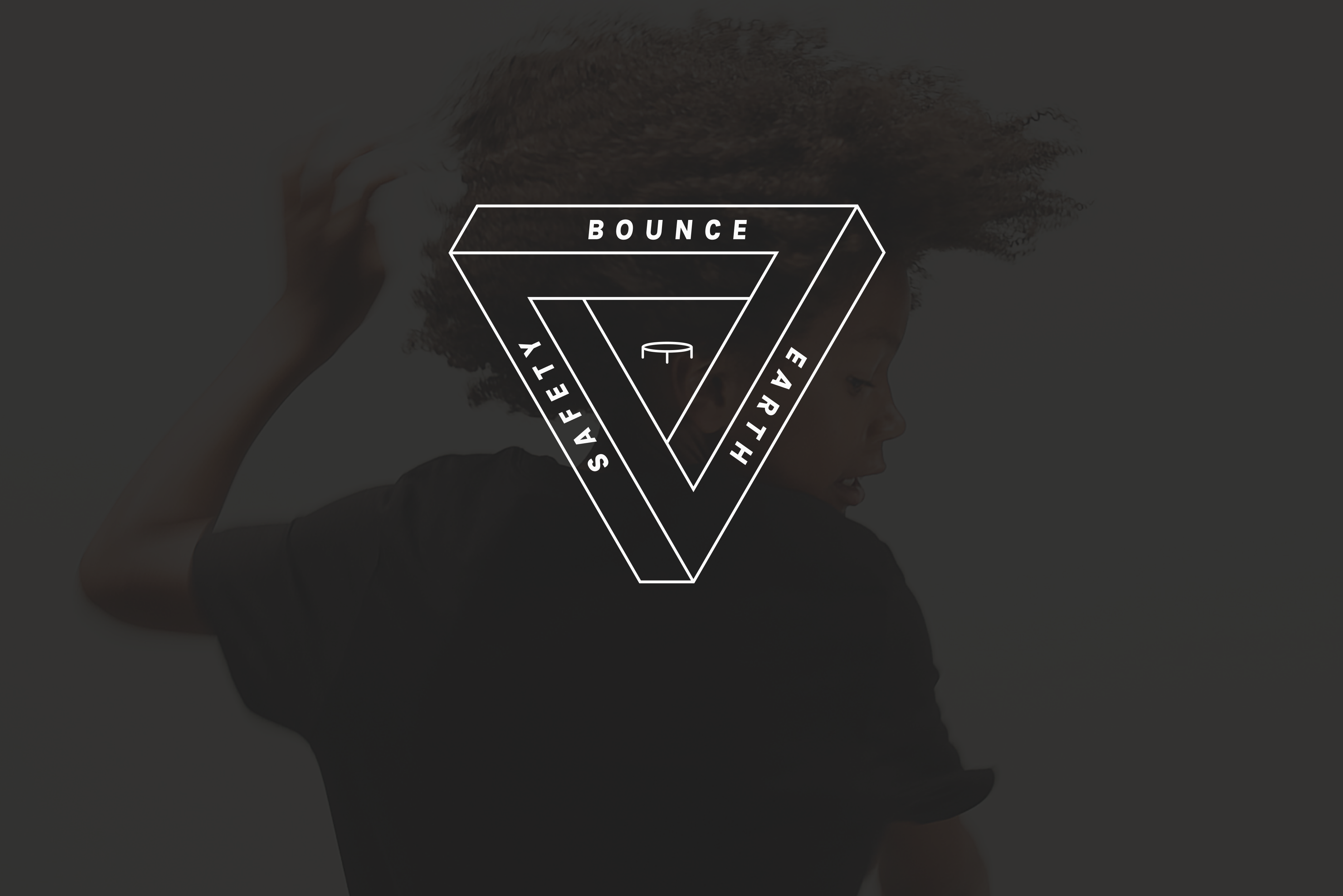 A white sign stating Bounce - Safety - Earth on a black background