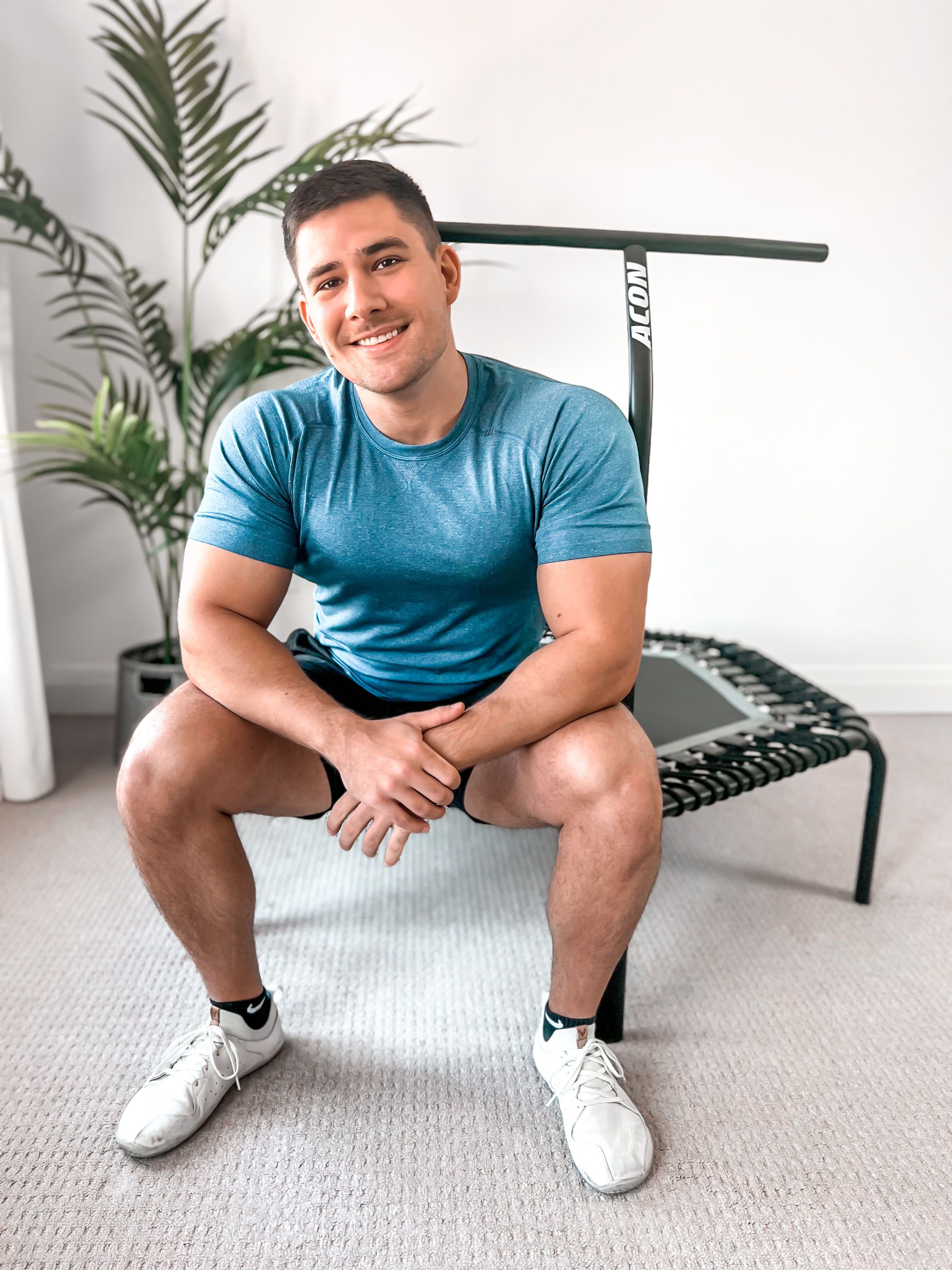A man sitting on an ACON rebounder