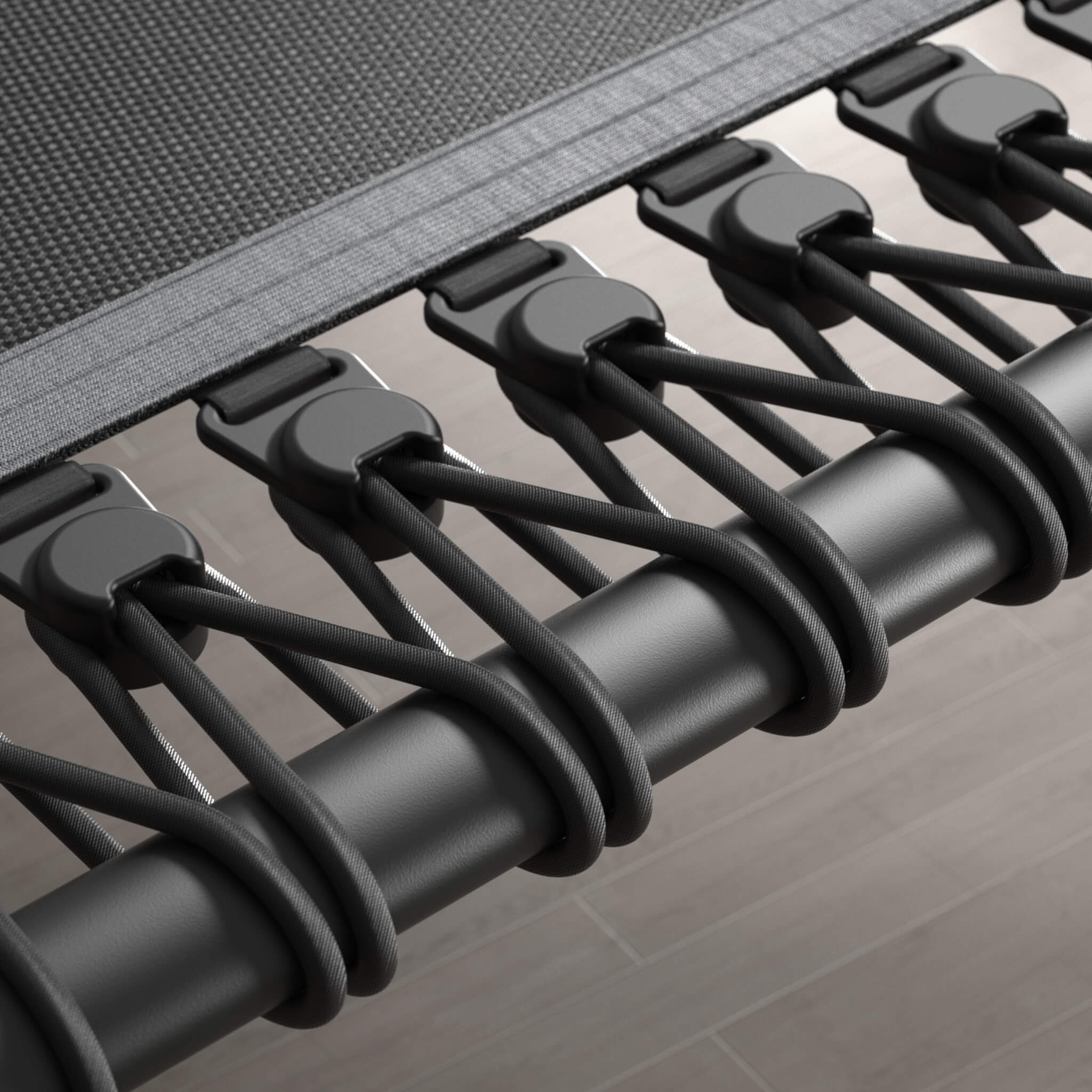 Close-up of the bungee cords of a black, hexagonal Acon FIT rebounder.