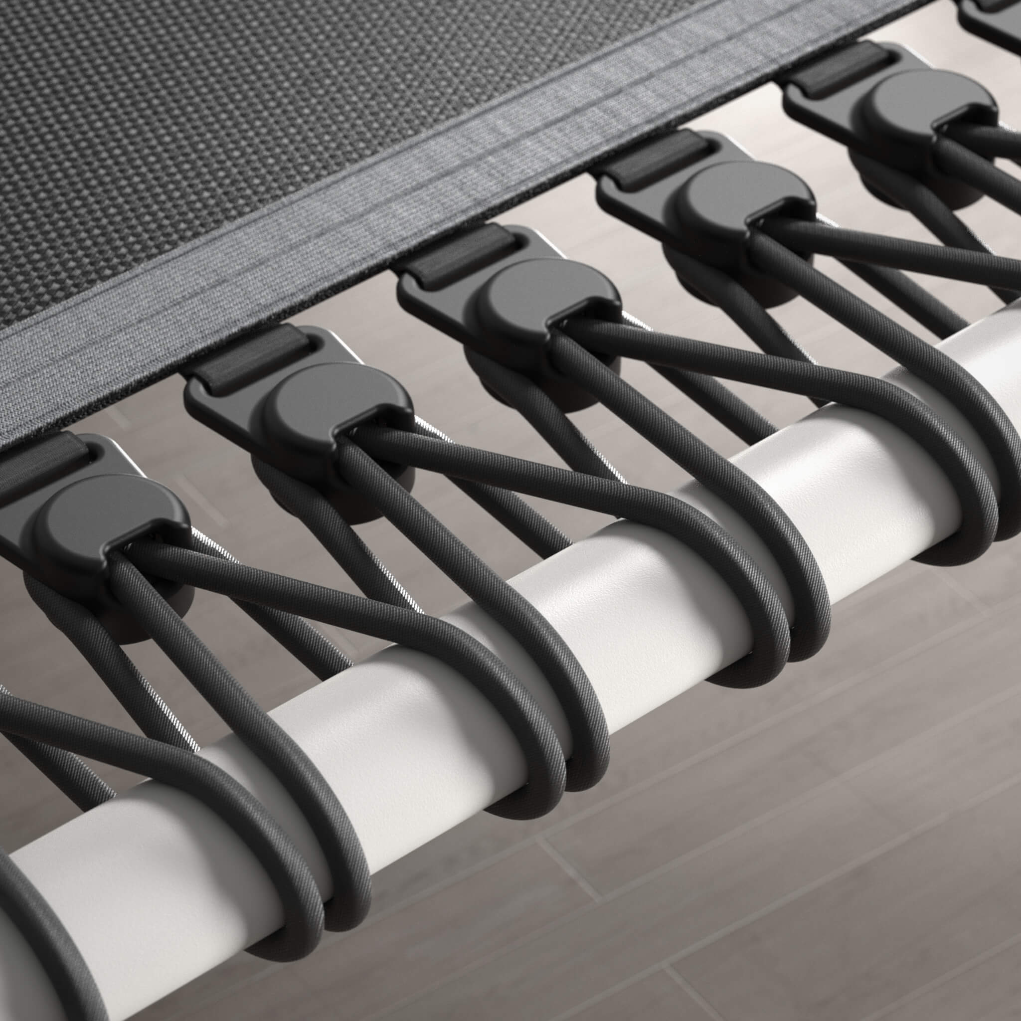 Close-up of the bungee cords of a white, hexagonal Acon FIT rebounder.