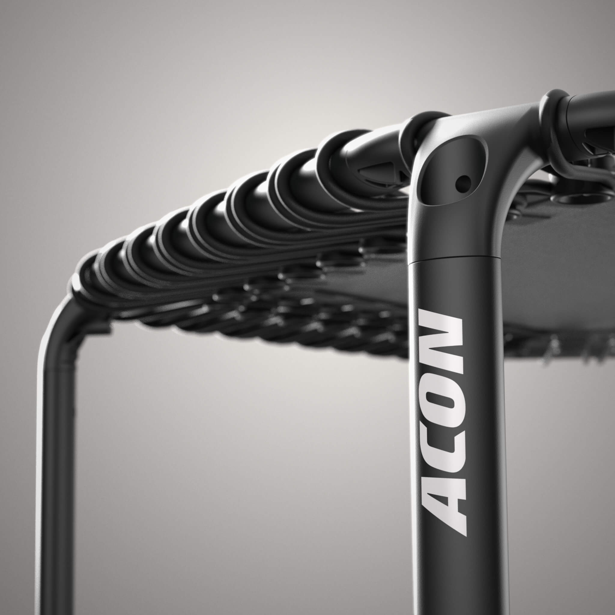 Close-up of a black, hexagonal Acon FIT trampoline.