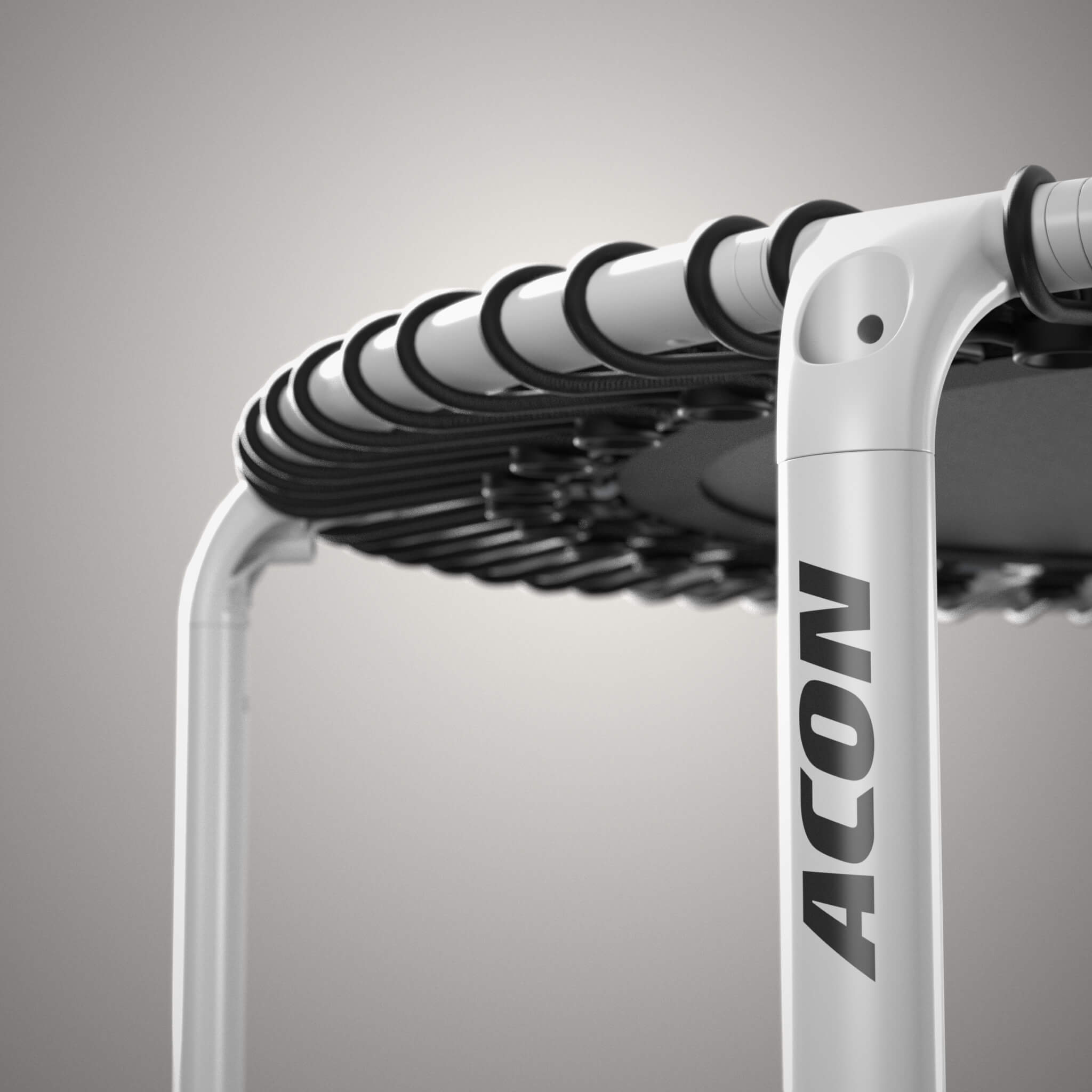 Close-up of a white, round Acon FIT trampoline.