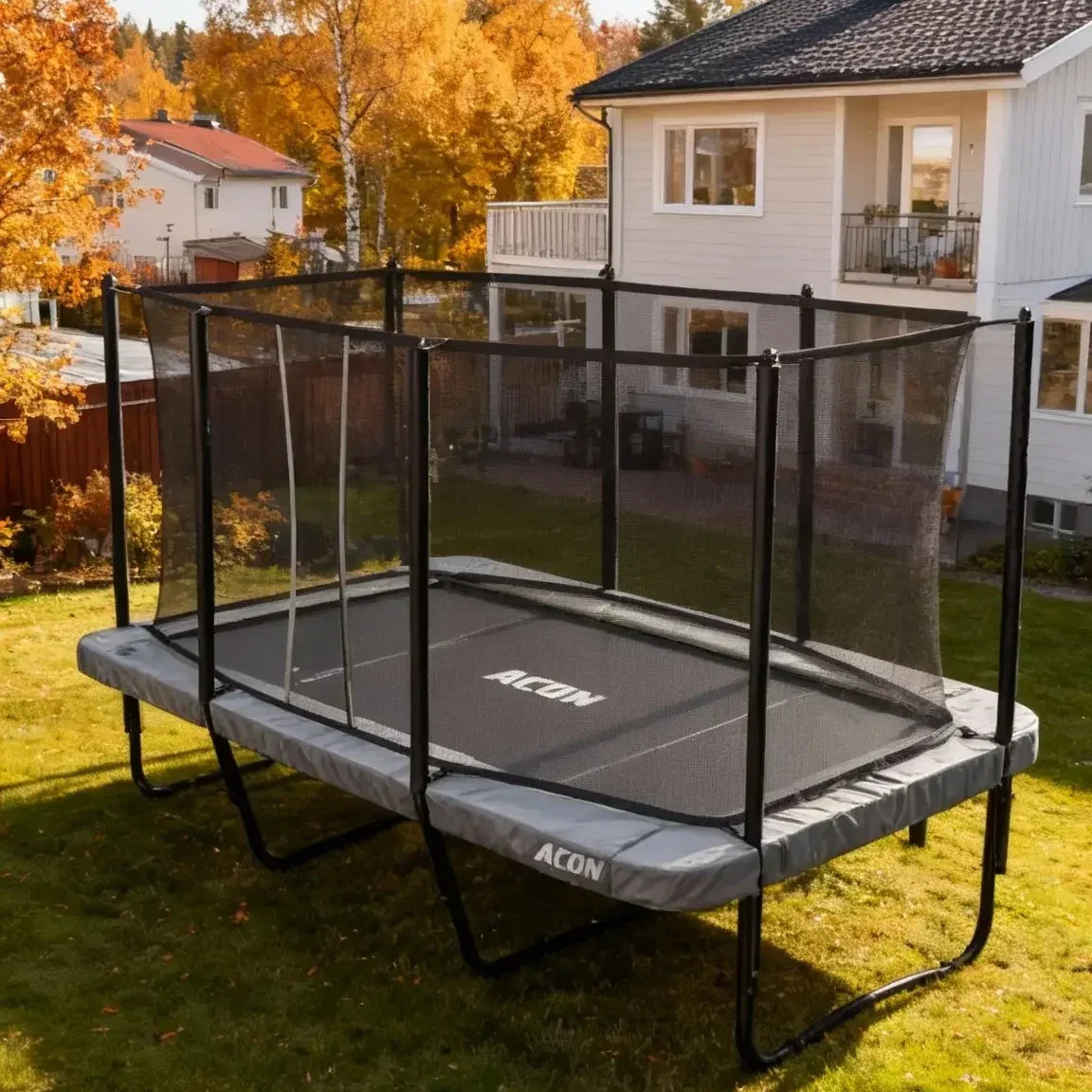 Acon HD 16 trampoline outdoors in a garden in nice and cozy autumn weather. 