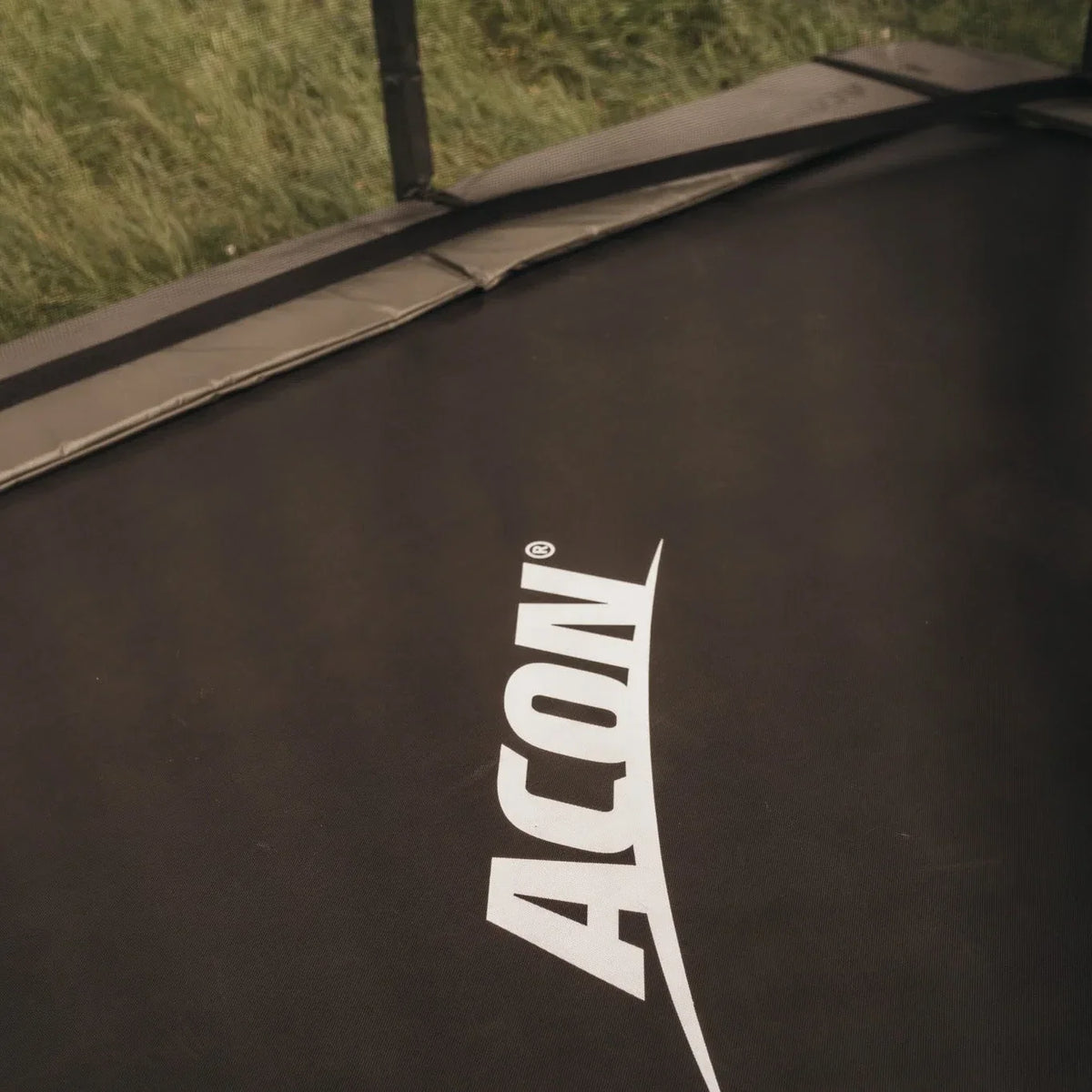 A closeup of a rectangular trampoline by ACON.