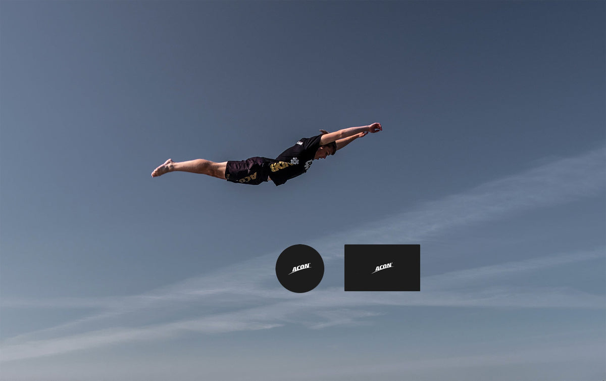 Trampoline jumper in the air, round and rectangular shapes