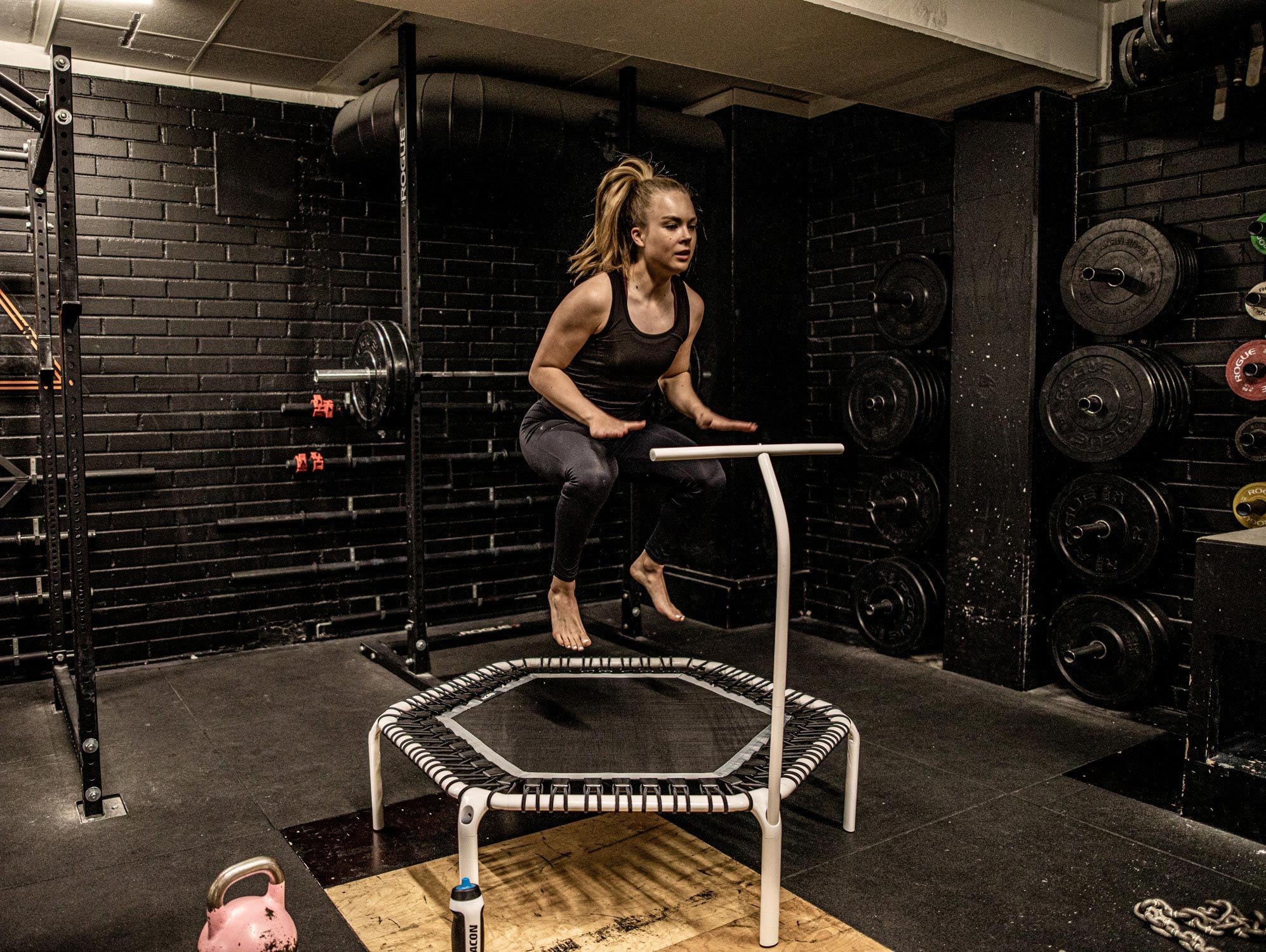 A jumper on a Acon Fit Trampoline with Handlebar