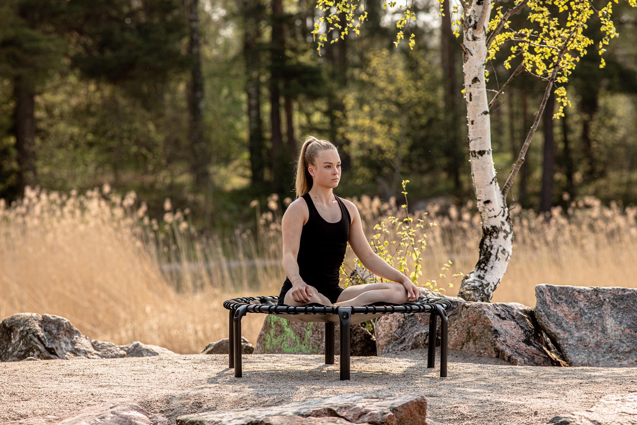 Outdoor Yoga moment on a fit trampoline