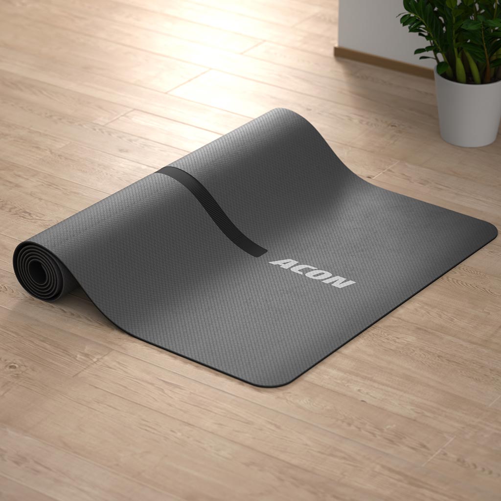 ACON yoga mat half rolled on the floor