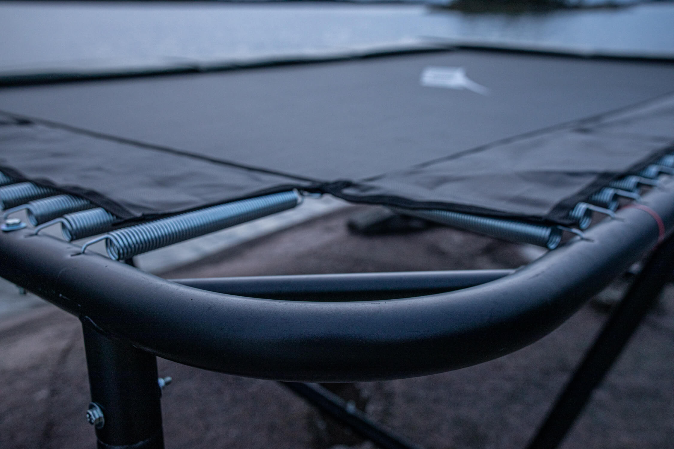 A closeup of ACON trampoline frame