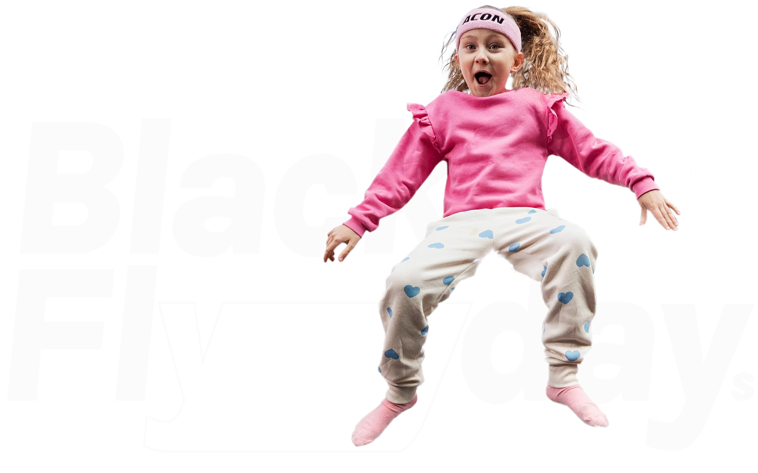 Smiling girl wearing a pink sweater and an Acon headband. White Black Flydays logo in the background.