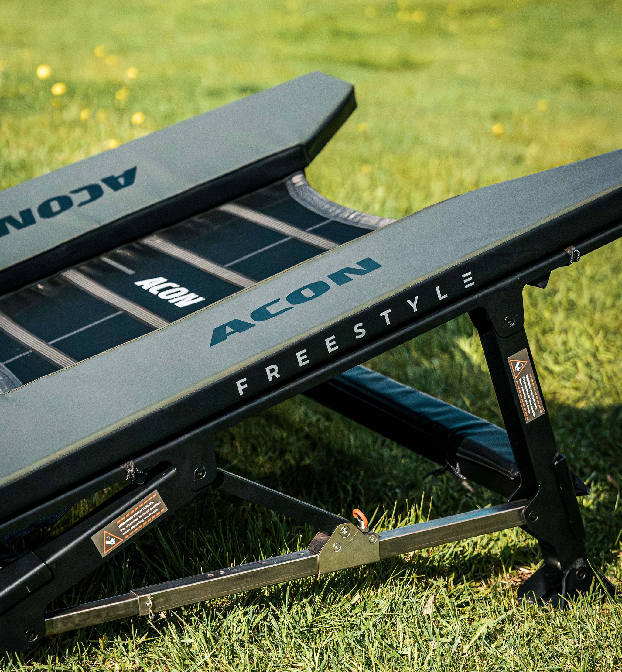 Close-up of the Acon Freestyle Mini Trampoline on the lawn.