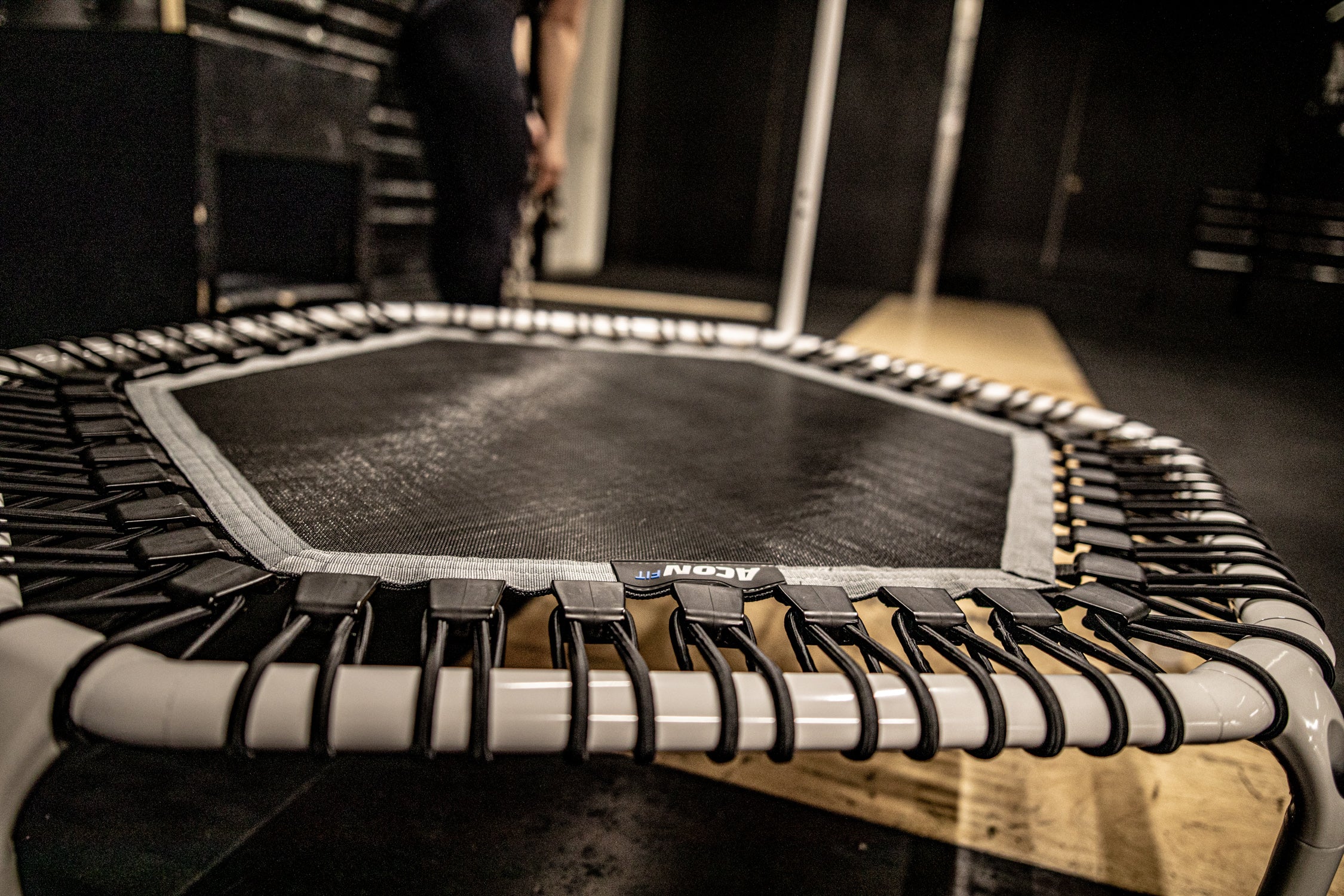 A closeup of the ACON hexagonal rebounder trampoline in white