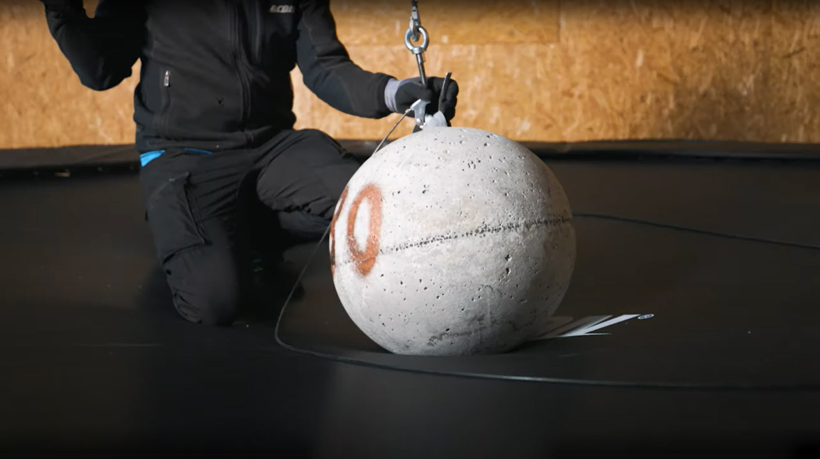 A weight testing ball on Acon trampoline mat