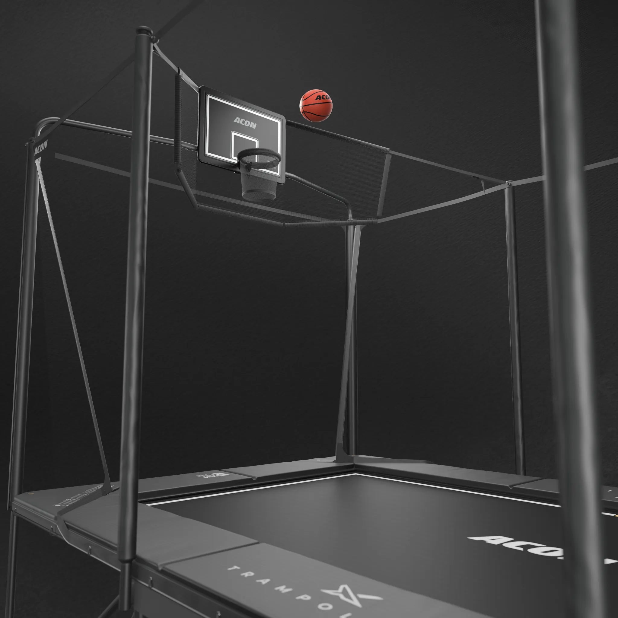 A detailed close-up of the Acon X 17ft trampoline featuring an installed basketball hoop and a wide back net designed to catch rebounds and stray shots.