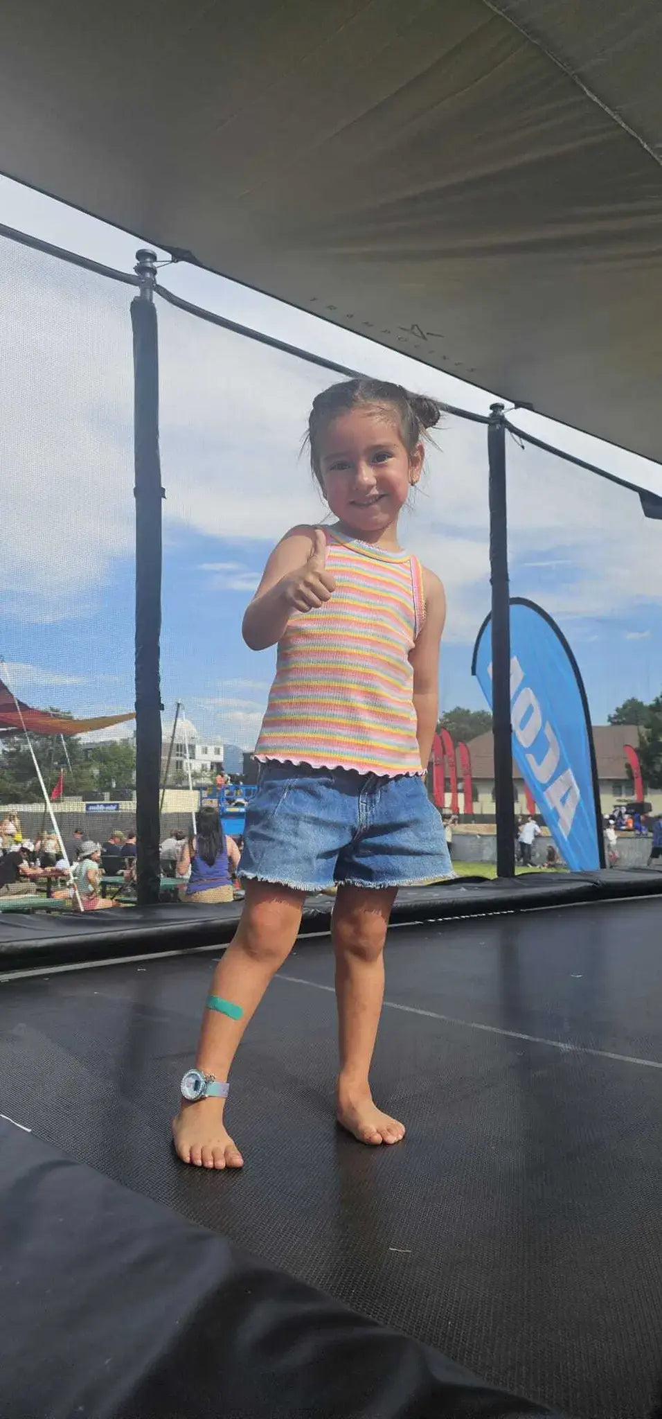 Child on ACON trampoline at X Games Action Zone.