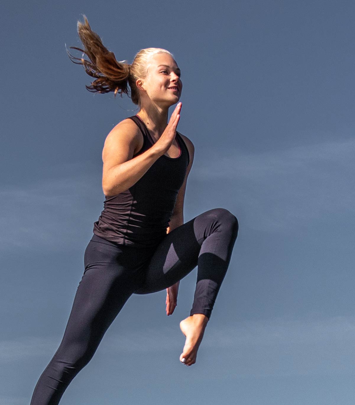 Jolly and relaxed trampoline jumper lady