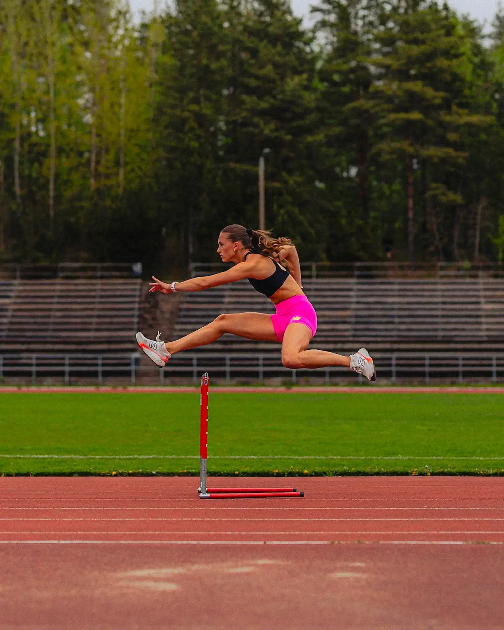 Mila Heikkonen jumping hurdles. 