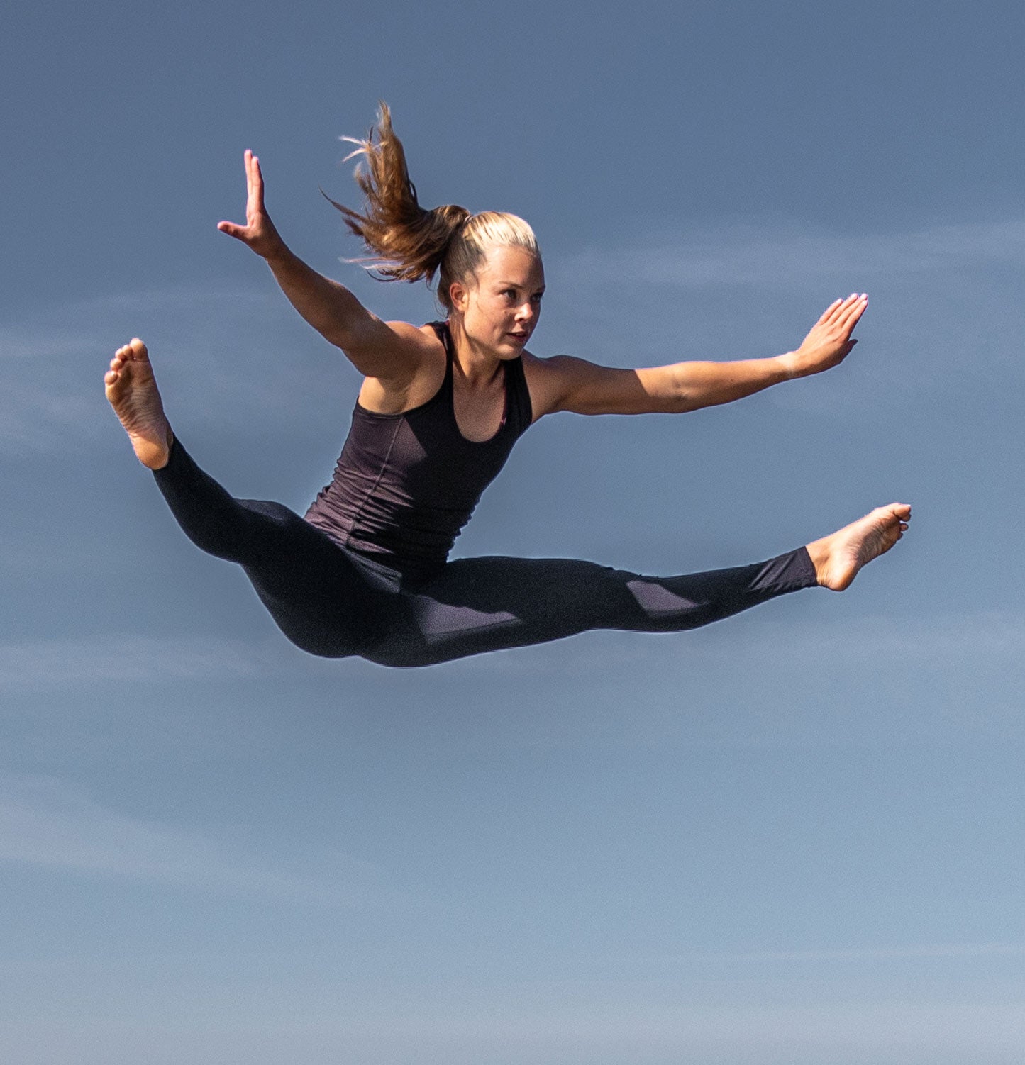 A trampoline straddle jump