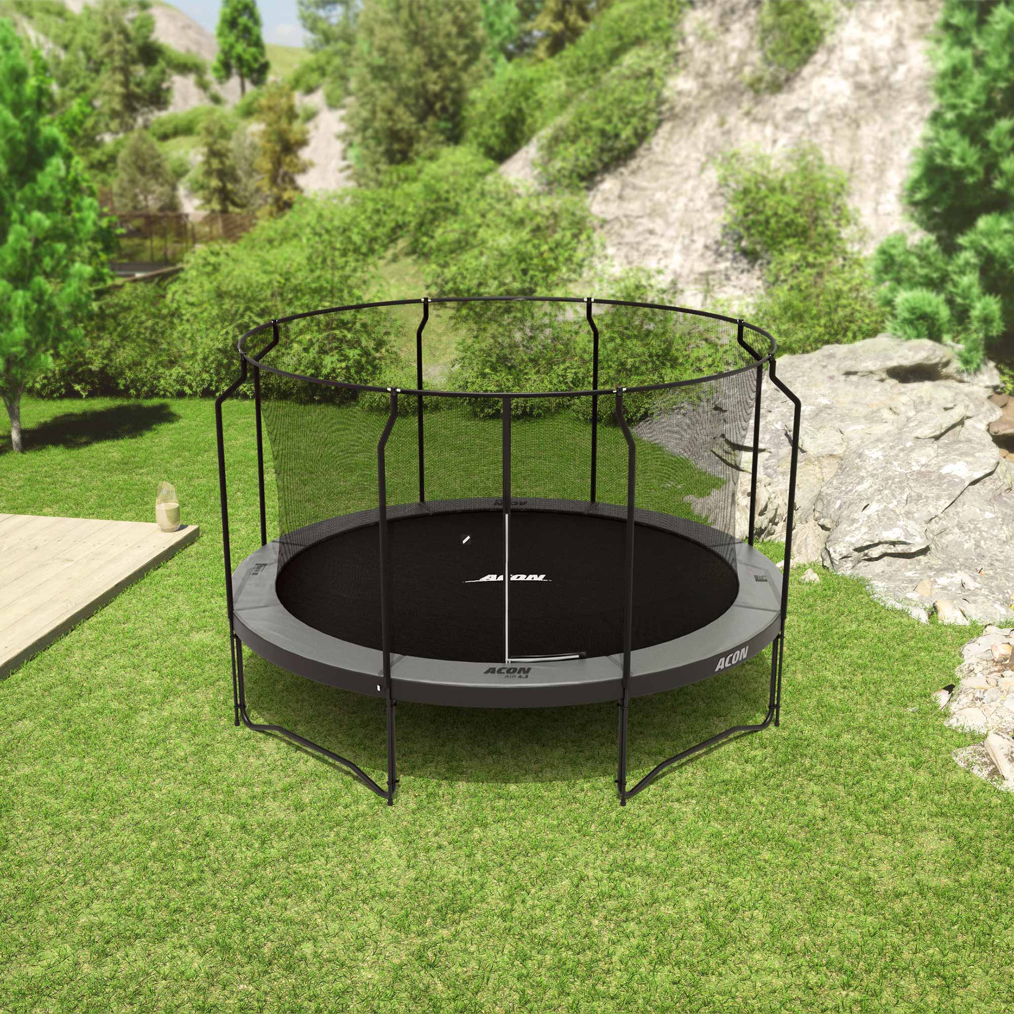 ACON Air 4,3m Trampoline Black with Premium Enclosure in the backyard.