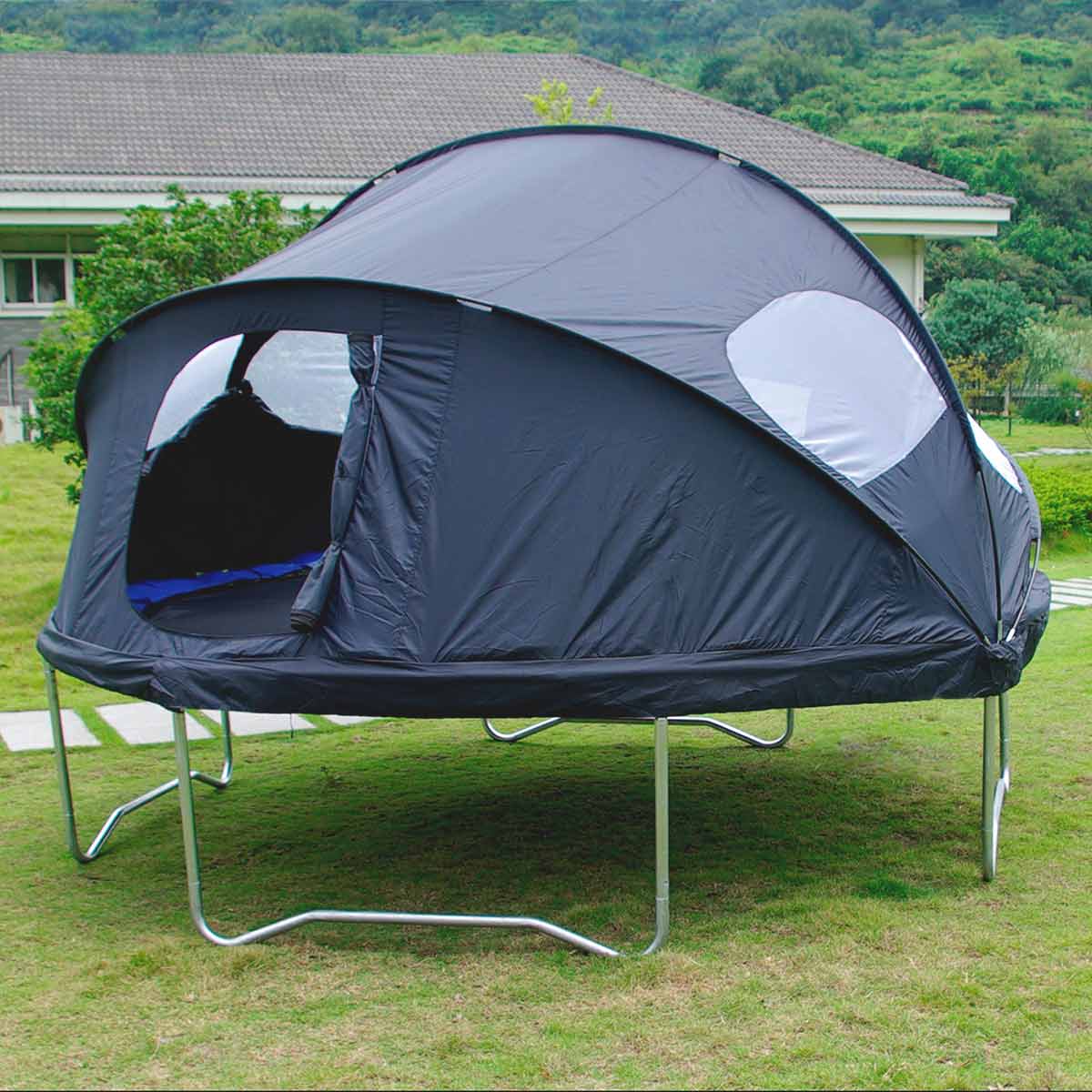 A trampoline on yard with a trampoline tent installed