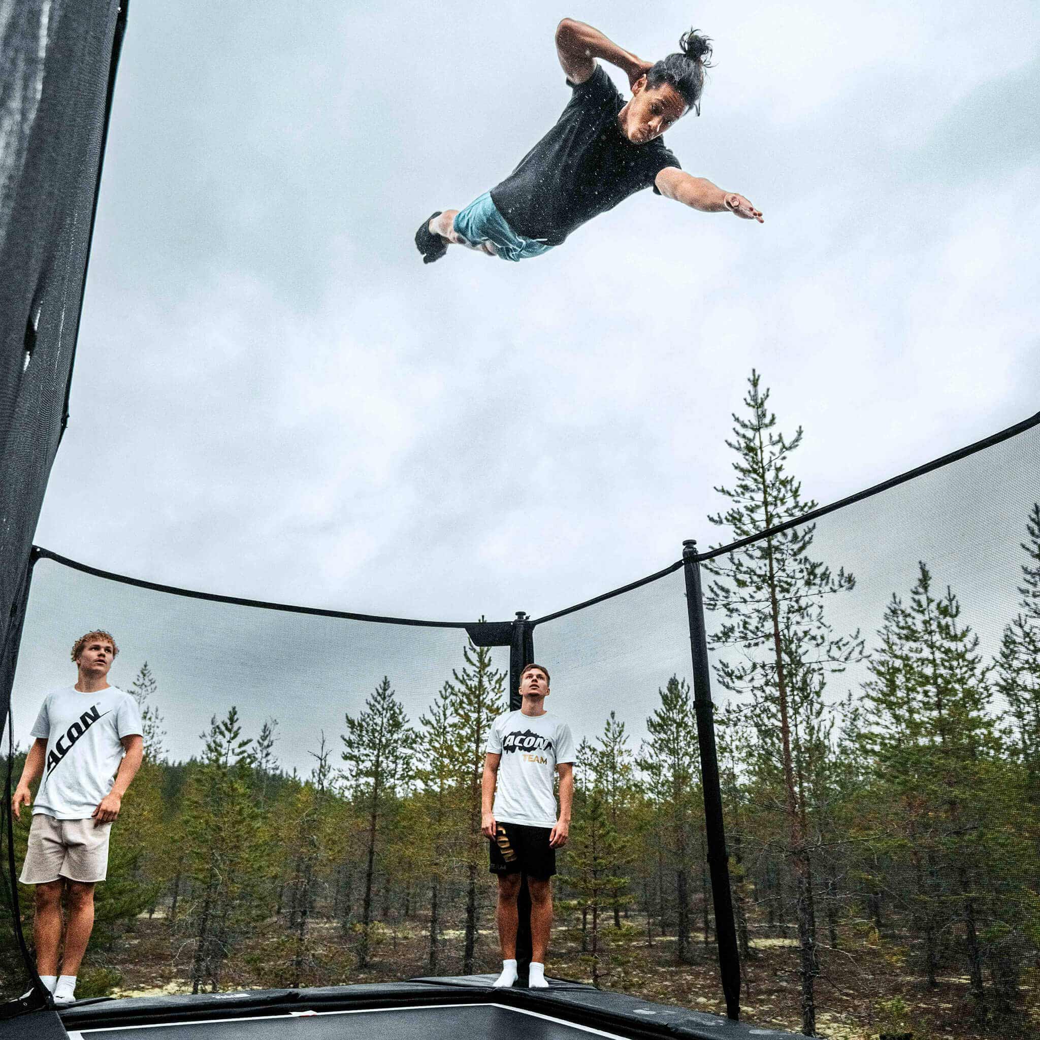 Trampoline trickster and his mates as an audience on an Acon X Trampoline.
